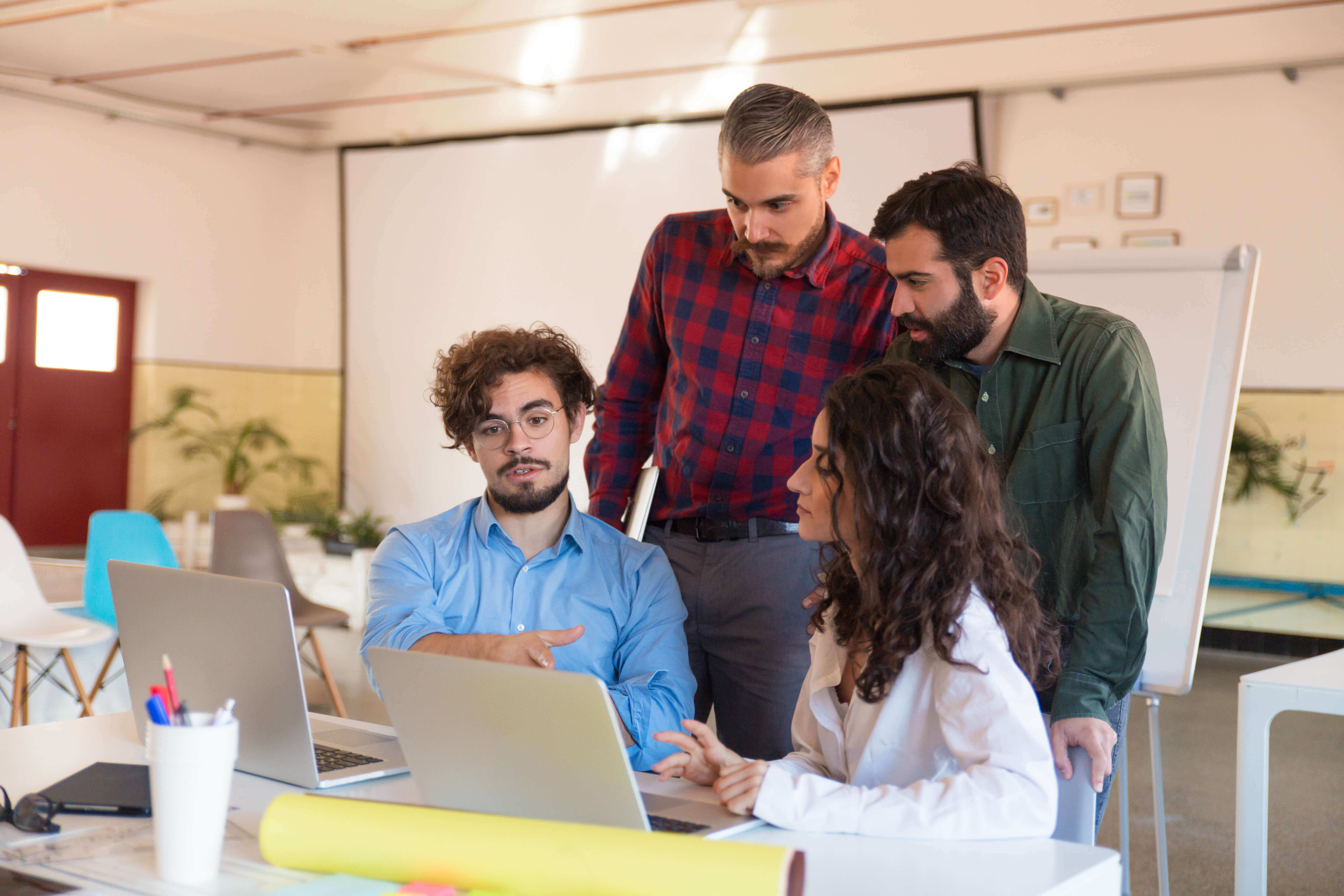 Engineering leader reviewing five strategies to scale a software development team without breaking budget